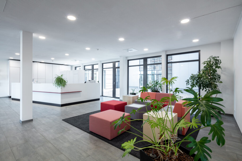 The prestigious entrance in the company colors welcomes customers from all over the world.